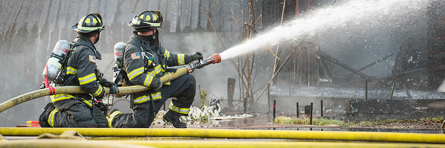 Firefighters training to put out a fire